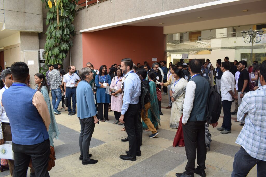 Attendees chat informally at the conference